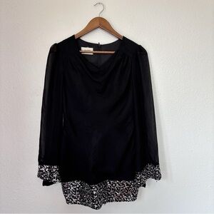 Elegant Black Long Sleeve Dress with Patterned Hem